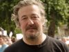 Stephen Fry returns to work after prostate cancer surgery